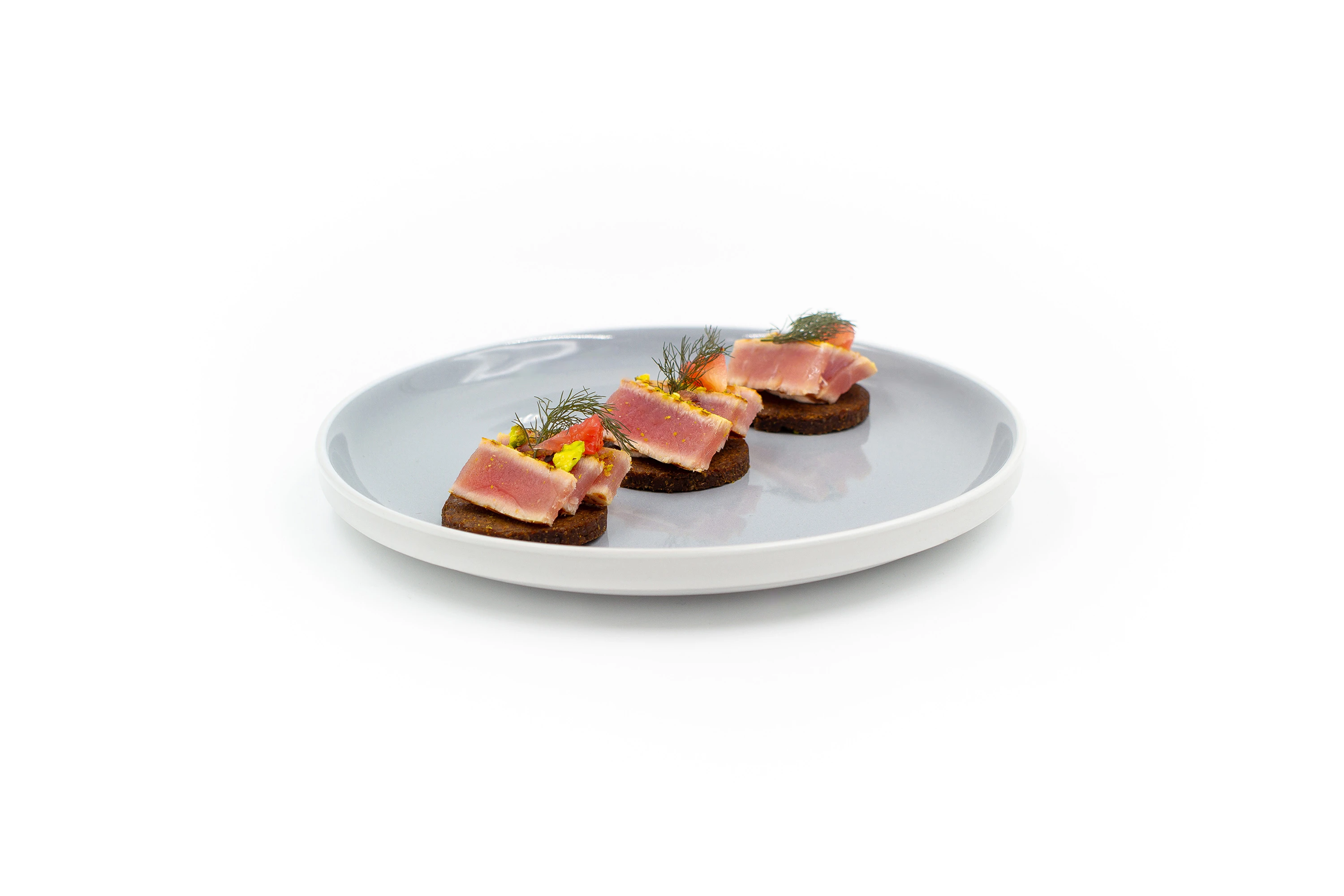 Ahi tuna, pink grapefruit, pistachio and pumpernickel.