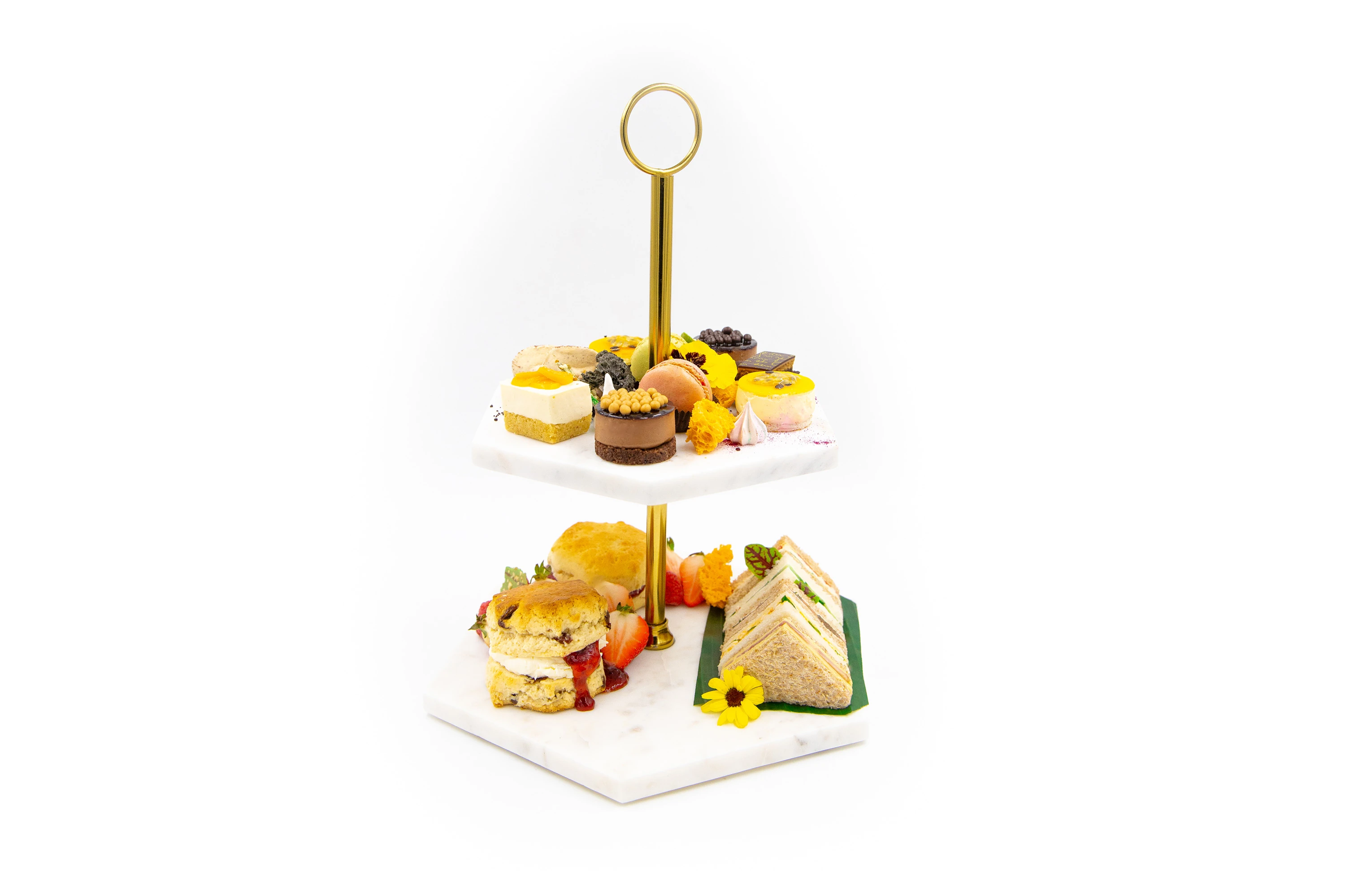 Classic english sandwiches, cakes, scones, jam and clotted cream.